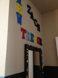 All three of the boys names and my LEGO mirror are what you see first when you enter the room.