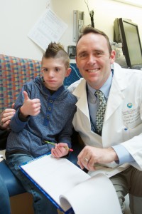 Christian with Dr. Birgfeld at the Craniofacial Center at Sea Children's