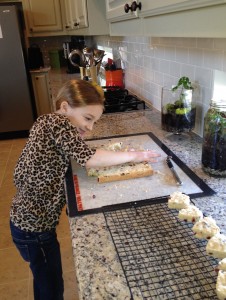 making cranberry shortbread cookies for her classmates