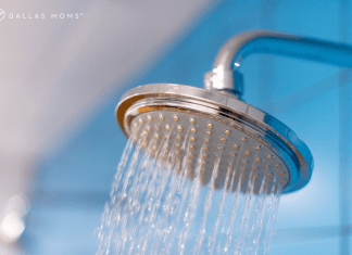 Spraying shower head with blue background