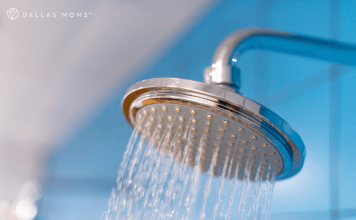 Spraying shower head with blue background