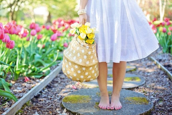 barefoot girl on a garden path in spring, spring activities for kids