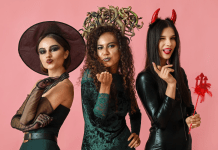 Women dressed up in Halloween costumes as a witch, Medusa, and the devil.