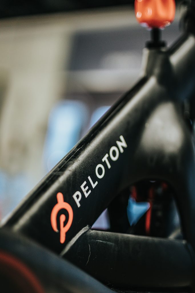 Peloton review, closeup of Peloton logo on bike