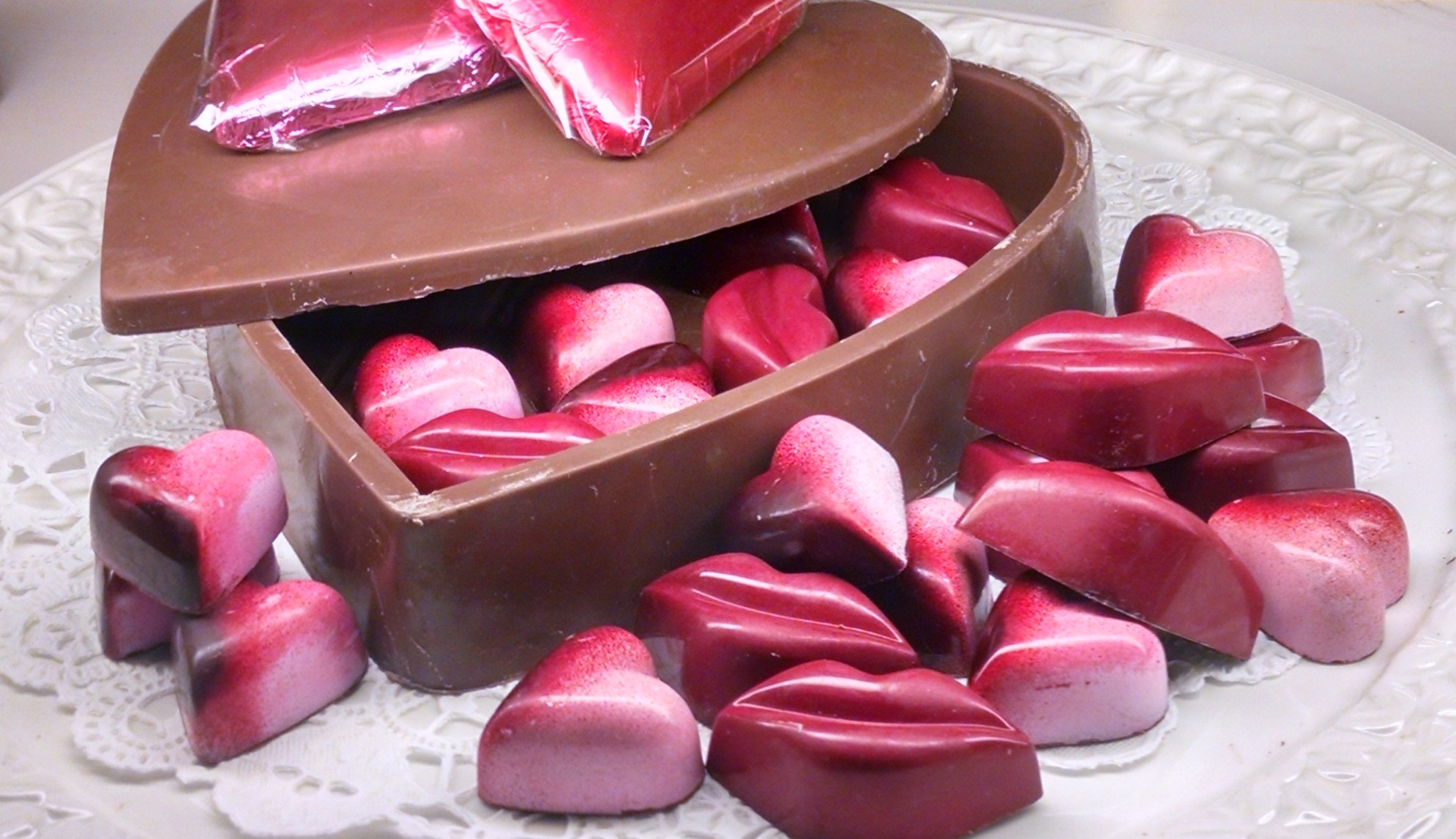 A heart-shaped chocolate box of chocolates.