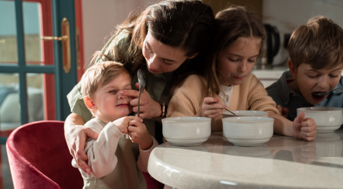 mother with 3 young children eating cereal, mom with an eating disorder