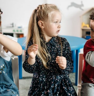 three children in preschool classroom, ready for kindergarten?