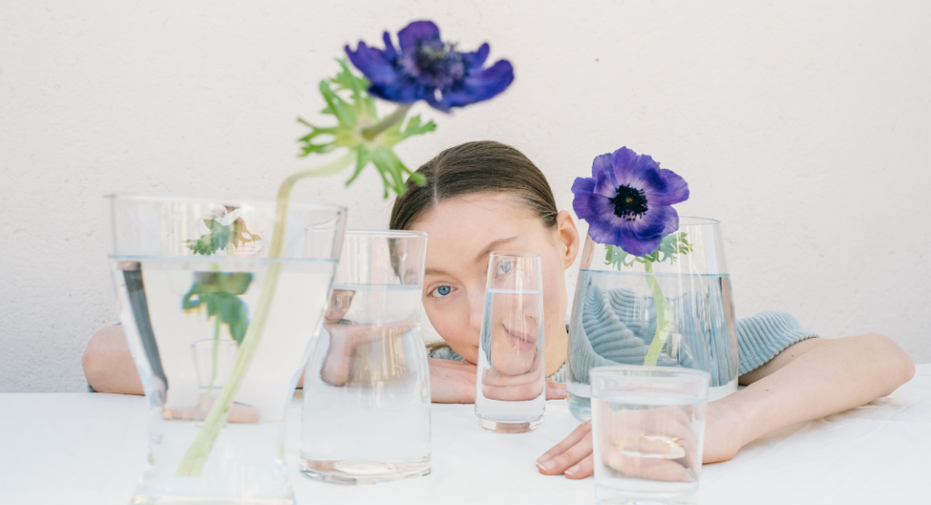 woman behind glass vases, autism resources in Dallas