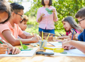 kids drawing at a table, camps with friends