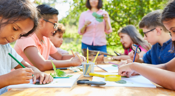 kids drawing at a table, camps with friends