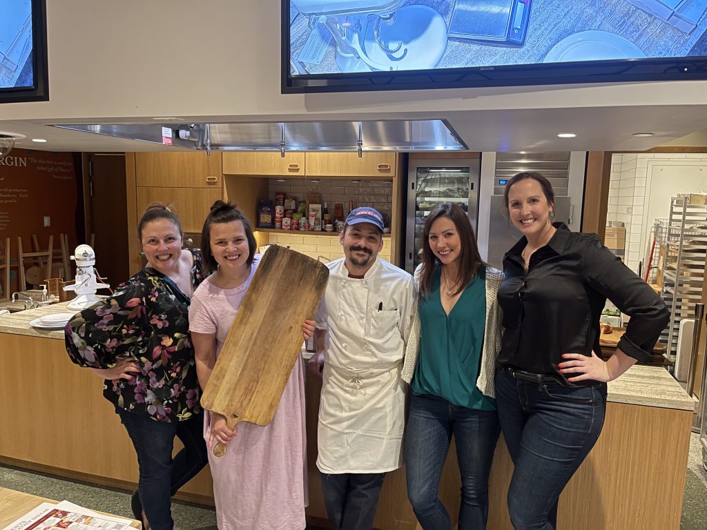 4 women posing with chef at Eataly Cooking Class Dallas
