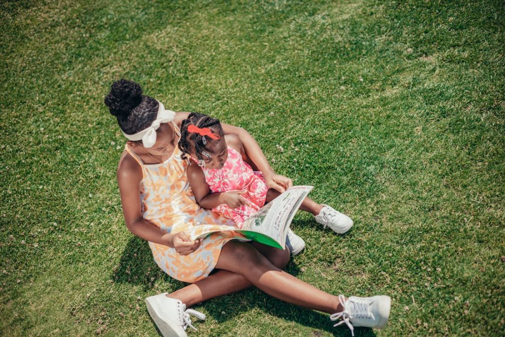 sisters reading a book, Dallas summer reading programs