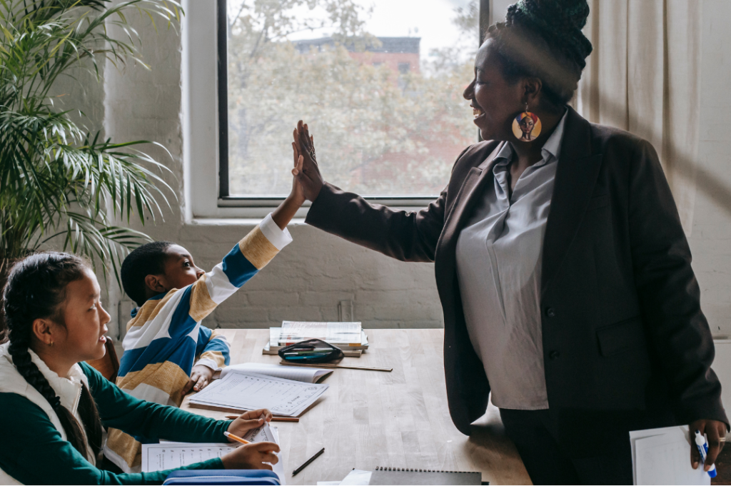 child giving teacher a high five