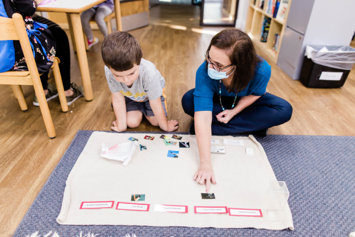 teacher and student at Wonderland Montessori Carrollton