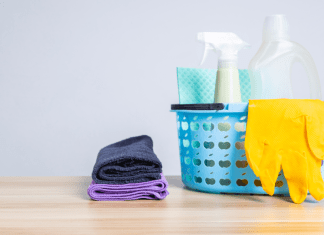 Cleaning supplies such as rubber gloves, multipurpose solution, and towels.