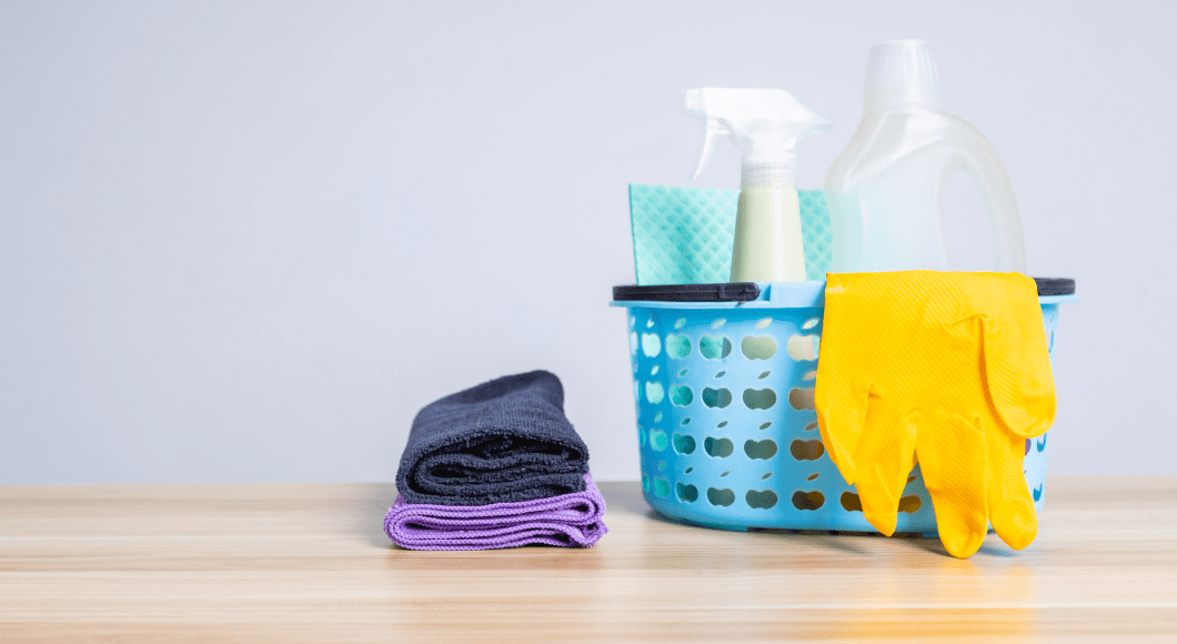 Cleaning supplies such as rubber gloves, multipurpose solution, and towels.