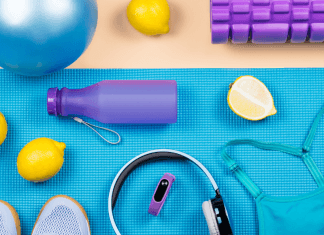 Workout accessories like a water bottle, headphones, sports bra, and more.