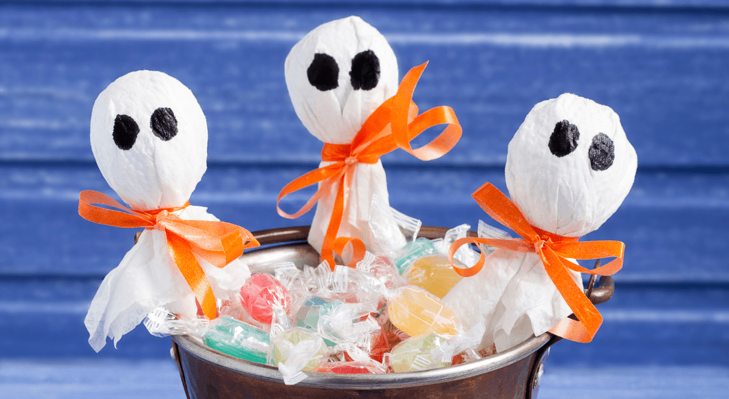 Lollipop ghosts in a bucket of candy.