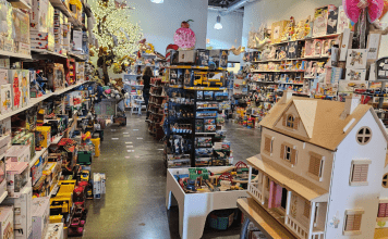 Toy Tree store in Plano with dollhouse and train set and toys displayed.