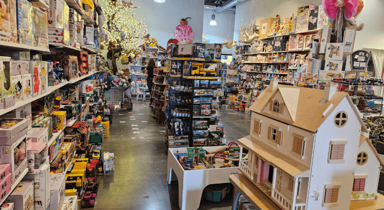 Toy Tree store in Plano with dollhouse and train set and toys displayed.