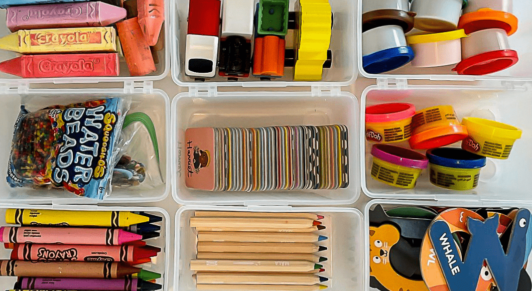 9 plastic bins holding a range of small, colorful toys