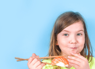 Child tries sashimi for the first time.