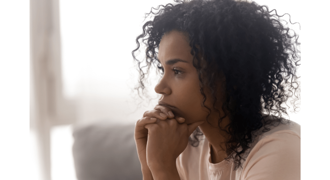 Woman sitting and reflecting