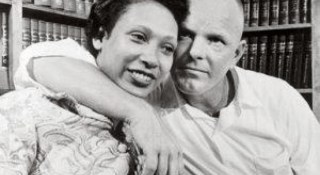 Black and white photo of Mildred Jeter and Richard Loving hugging in 1967
