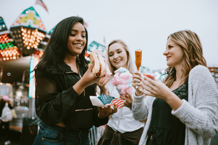 Moms try fair food at the State Fair of Texas.