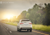 Car drives down the highway on a family road trip.