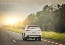 Car drives down the highway on a family road trip.