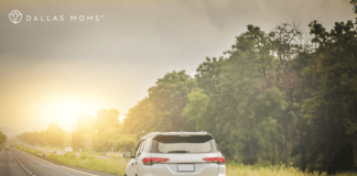 Car drives down the highway on a family road trip.