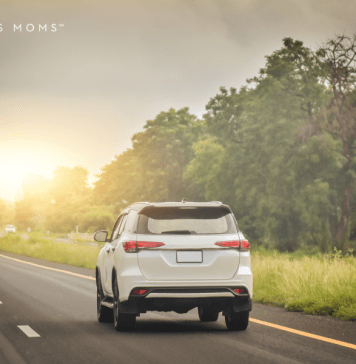 Car drives down the highway on a family road trip.