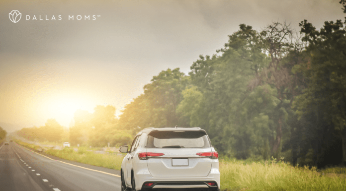 Car drives down the highway on a family road trip.