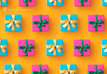 Presents wrapped in pink and blue with gold and green ribbons sit on a bright orange surface.